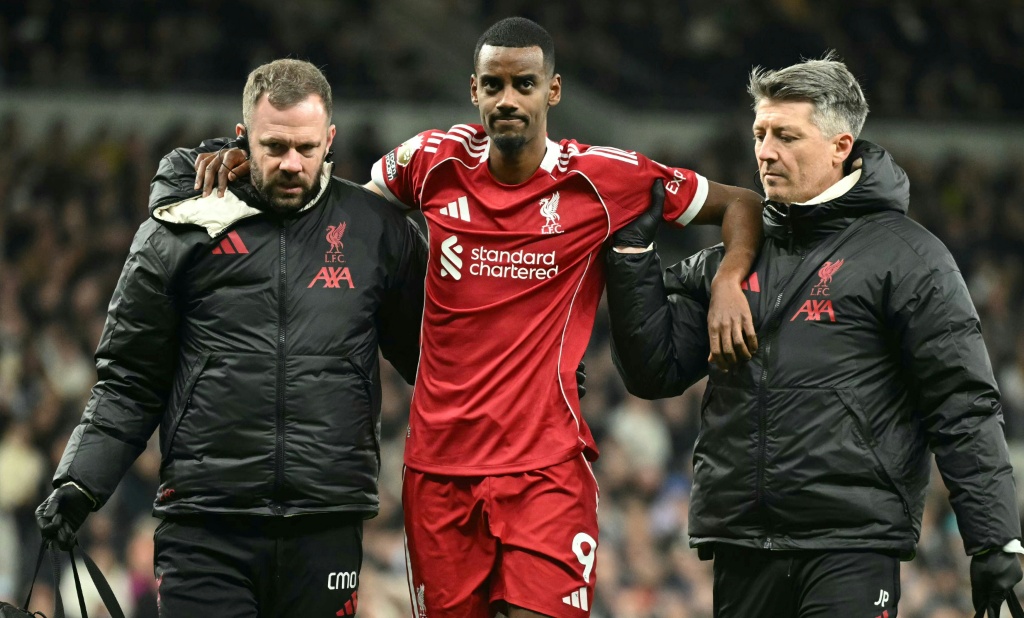 Liverpool triumph over nine-man Tottenham yet Isak departs injured following uncommon strike